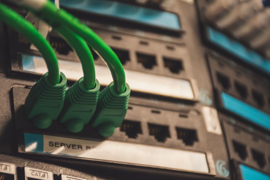 Green network cables plugged into server ports